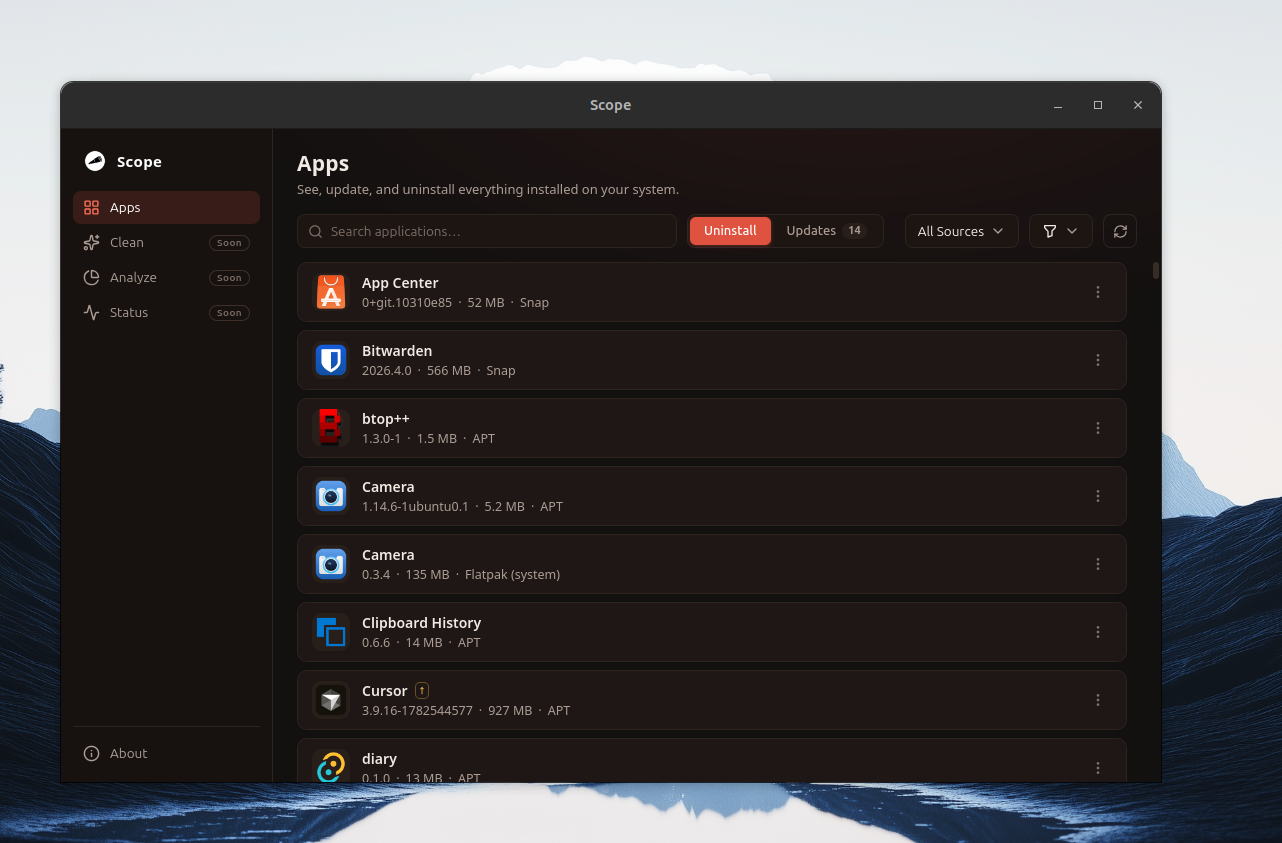 Scope's main window listing installed apps — App Center and Bitwarden from Snap, btop++ and Camera from APT, Camera from Flatpak — with search, source filters, and an Updates counter